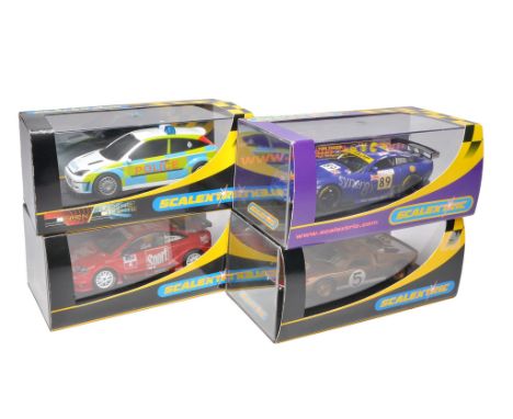 Scalextric slot car issues comprising Opel V8 Coupe, Ford GT MKII, TVR Tuscan 400R plus Ford Focus 'Police Car'. All appear t
