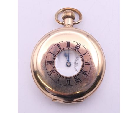 A rolled gold half hunter pocket watch, case marked Star Dennison and numbered 186467. 5 cm diameter.