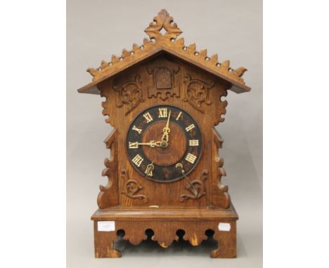 A Victorian oak cuckoo clock. 55 cm high.