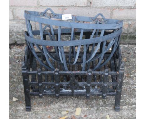 An iron fire grate and a pair of iron wall flower baskets. The former 38 cm wide.