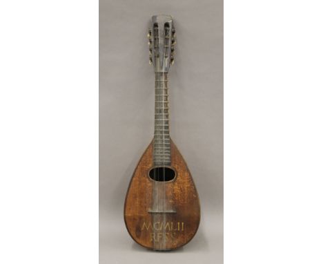 A vintage mandolin. 59 cm long.