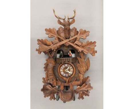 A cuckoo clock. 42 cm high.
