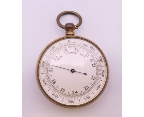 A Victorian brass pocket barometer. 4.75 cm diameter.