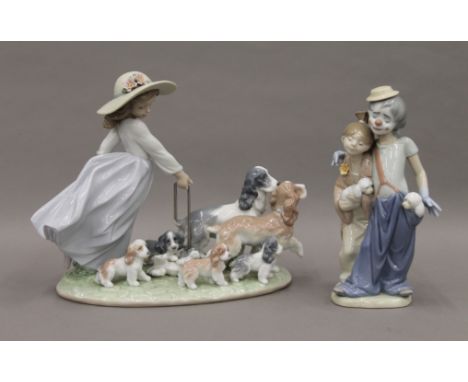 Two large boxed Lladro figures. The largest 28 cm long.