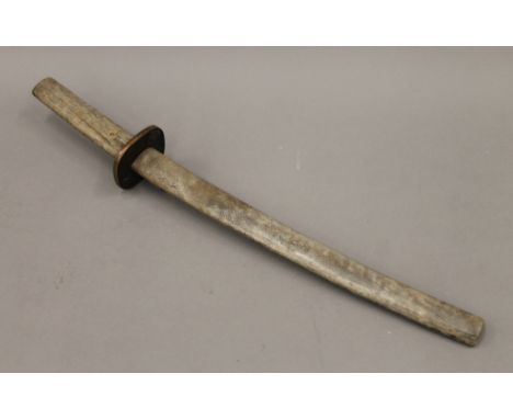 A Japanese sword with shagreen scabbard. 60 cm long.