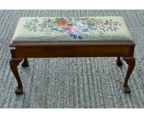 An early 20th century duet piano stool with tapestry seat. 100 cm long.