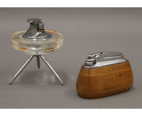 Two vintage cigarette lighters. The largest 9 cm high.