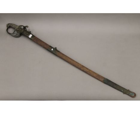 A Victorian Henry Wilkinson Service sword in scabbard. 102 cm long.