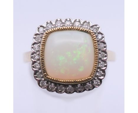 A 9 ct gold opal and diamond ring. Ring size O/P. 4.7 grammes total weight. 