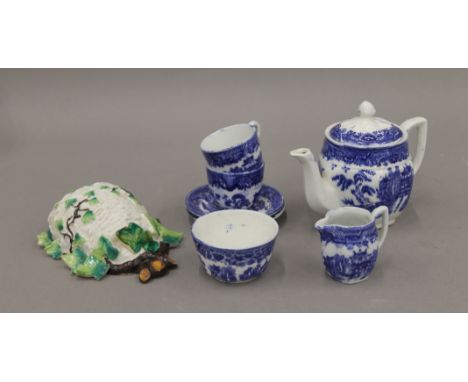 A child's Willow pattern blue and white tea set and posy holder. The teapot 11 cm high.