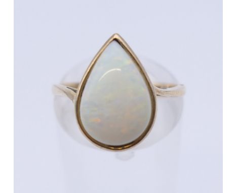 A 9 ct gold and opal ring. Ring size M. 