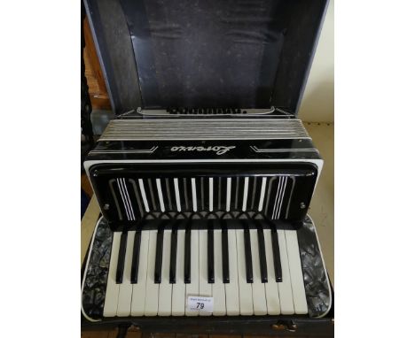 A Lorenzo cased piano accordion.