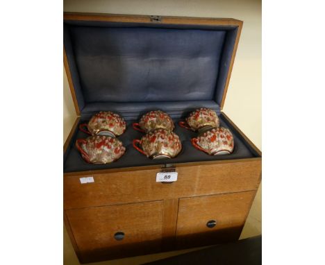 A Japanese eggshell tea service in a fitted wooden travel case.