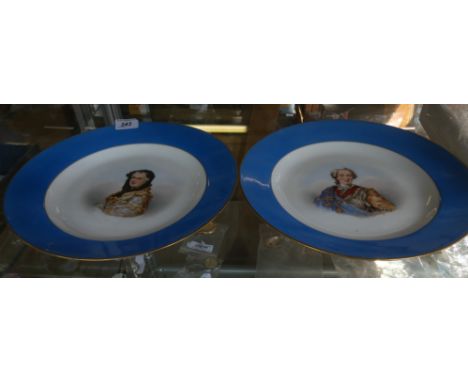 A pair of 19th Century French ceramic wall chargers, each hand painted with busts of Louis XV & Marie Leszczynska, diameter 3