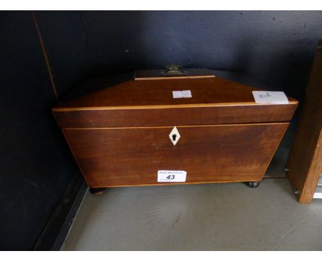 A 19th Century mahogany and inlaid sarcophagus formed tea caddy with fitted interior. 