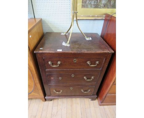 A George III and later oak chest of three drawers raised on bracket feet, height 85cm, width 70cm, depth 49cm.