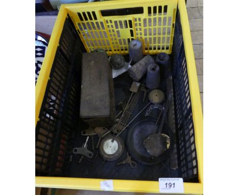 A mixed lot of various assorted clock weights, clock keys, pendulums and other parts