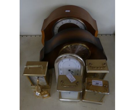 A mixed lot comprising two domed top mantel clocks in veneered cases, together with four modern carriage type clocks, a furth