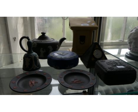 A collection of Wedgwood Jasperware to include a Lectern, a black teapot, dressing table trinket box, a bell, two pin dishes 