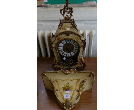 A modern floral decorated continental bracket clock with applied metal mounts together with accompanying wall bracket.