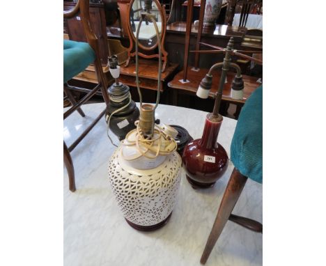 A bronze finished table lamp together with two further ceramic table lamps (sold electrically untested) 