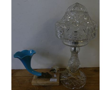 A mixed lot comprising a cut clear glass table lamp with lift off shade, together with a blue opaque glass cornucopia vase on