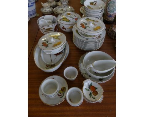 A quantity of Royal Worcester Evesham pattern tableware to include serving dishes, plates, bowls, sauceboat and other items.