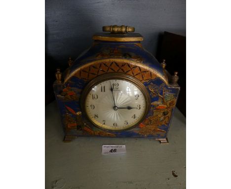 An early 20th Century mantel clock in japaned finish case, the face marked Finnegan's.