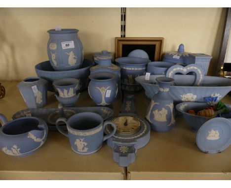 A collection of Wedgwood blue Jasperware to include a range of vases, small jardiniere, tea canister, various bowls, wall clo