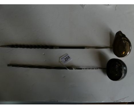 A Georgian silver punch ladleOf conventional form, with a twist whale bone handle and plain bowl with spout to one side, leng
