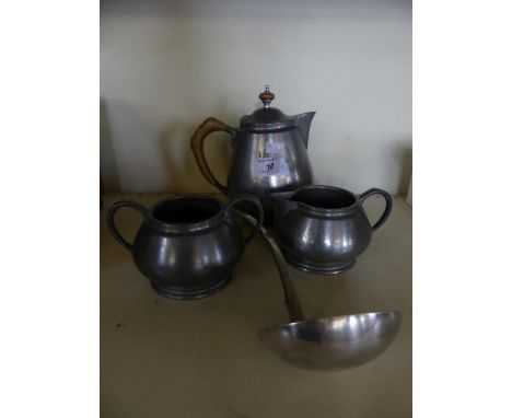 Tudric three piece pewter tea service together with a silver-plated soap ladle 