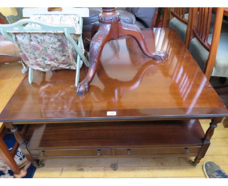 A large reproduction mahogany coffee table of large square proportions with under tier drawers 