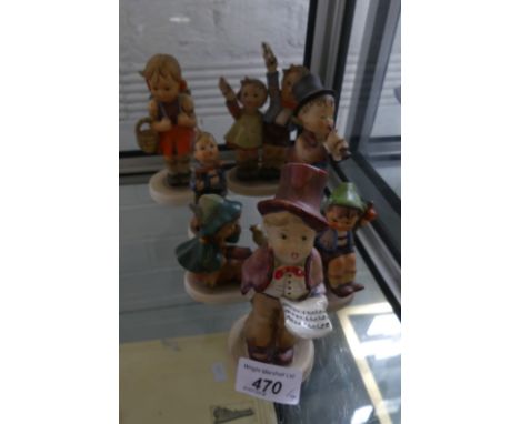 A group of seven Goebel and other models of children.