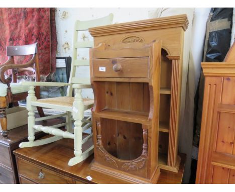 A mixed lot comprising two small pine shelf units with carved detail, together with a rush seated ladderback rocking chair (3