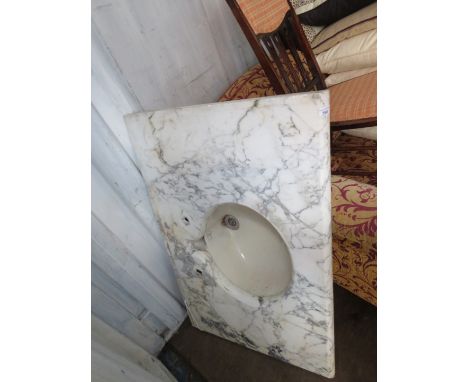 An Antique Royal Doulton basin, inset into a grey veined marble surround