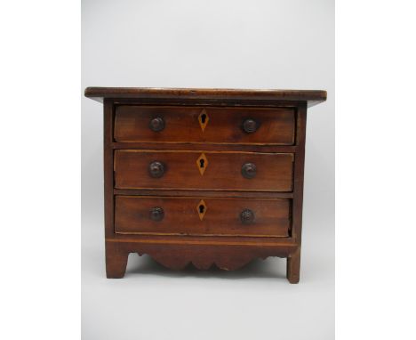 A Victorian satinwood string inlaid mahogany traders sample chest of three drawers, with turned handles, on bracket feet, A/F