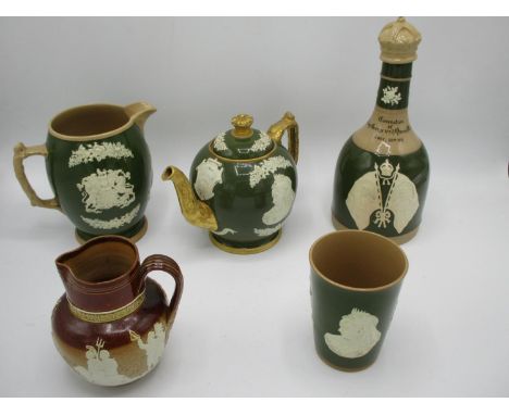 A group of four Copeland Spode George V and Victorian commemorative ware with raised decoration on a green ground, comprising