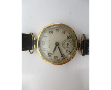 An early 20th century Rolex manual wind 9ct gold ladies wristwatch, having Arabic numerals with subsidiary seconds dial, fitt