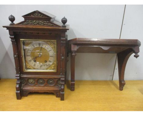 A late 19th/early 20th century German bracket clock with wall bracket. The walnut case having gilt metal mounts and twin carr