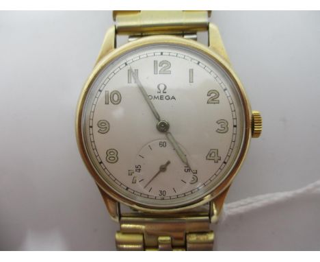 An Omega 9ct gold gents manual wind wristwatch circa 1944, the dial having Arabic numerals and subsidiary seconds dial. The 1
