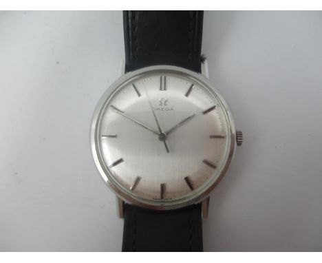 An Omega manual wind, gents stainless steel 1960s wristwatch having a silvered dial with centre seconds, Omega crown, leather