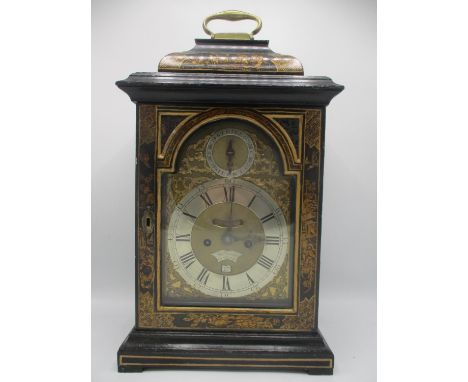 A mid 18th century bracket clock by Thomas Gardner, London, a bell top Japanned case, the arched top dial having a brass matt