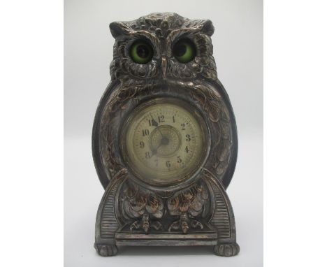 An early 20th century Arts &amp; Crafts silver plated fronted mantle clock modelled as an owl with automaton moving eyes, 6 1