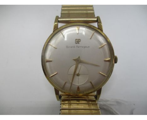 A Girard Perregaux 18ct gold gents manual wind wristwatch having a silvered dial with baton markers and subsidiary seconds di