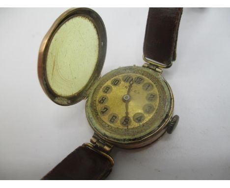 An early 20th century Rolex manual wind 9ct gold ladies wristwatch having a gilt dial, the case back with initials, fitted wi