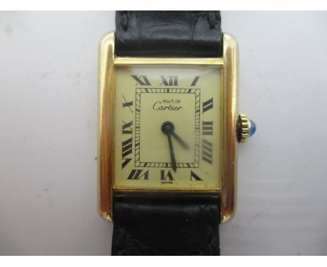 A Must de Cartier, silver gilt manual wind ladies watch having sapphire inset crown, the case back inscribed 'Cartier Paris 9