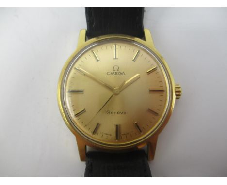 An Omega gold plated gents manual wind wristwatch having a gilt dial with central seconds, on a later leather strap with Omeg