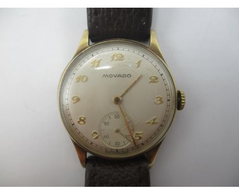 A Movado manual wind 9ct gold gents wristwatch, the silvered dial having Arabic numerals and subsidiary seconds dial, the Den