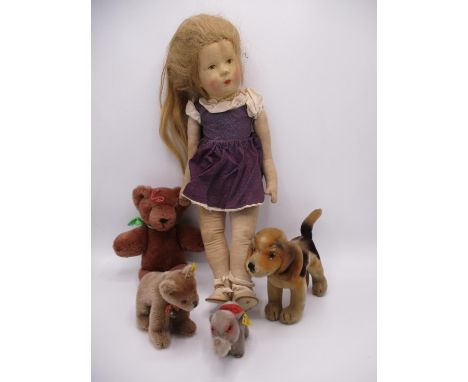 A German painted faced and cloth body doll with blond hair and a purple dress, 20" h, along with a Steiff bear, an elephant a