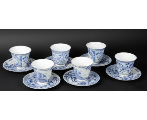 A set of six porcelain high model cups and saucers with landscape/ship decor marked with 6 character marks. Japan, 19th centu